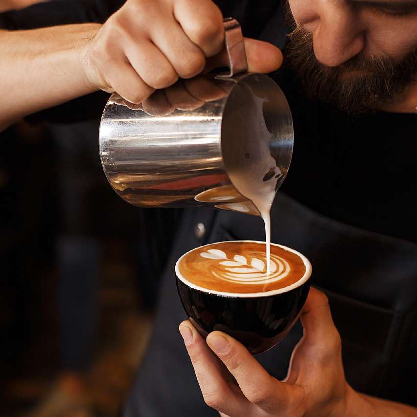 Latte art being poured